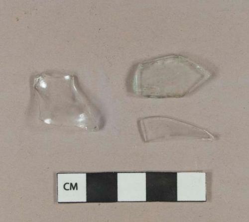 Two colorless bottle glass fragments; one aqua bottle glass fragment