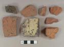 Brick fragments, one redware rooftile fragment, one stone fragment