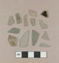 Aqua flat glass fragments; aqua bottle glass fragment; olive green bottle glass fragment; etched colorless curved glass fragment