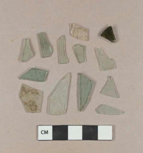 Aqua flat glass fragments; aqua bottle glass fragment; olive green bottle glass fragment; etched colorless curved glass fragment