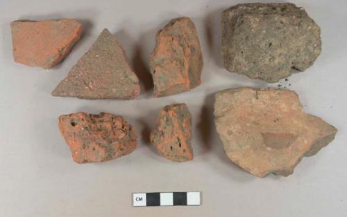 Brick fragments, redware roof tile fragment, stone fragment