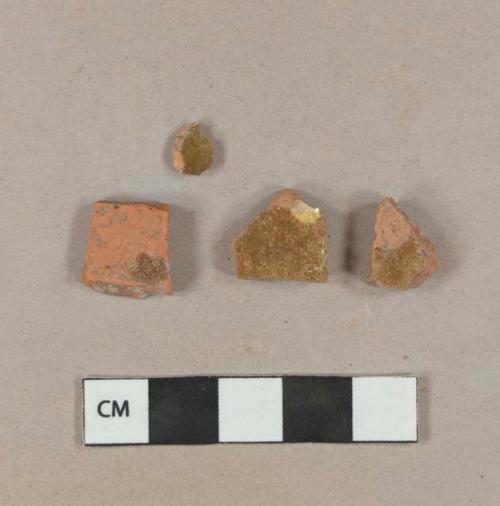 Undecorated lead glazed redware body sherds; slip decorated lead glazed redware body sherd