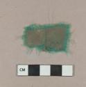 Green fabric fragment