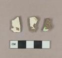 Undecorated creamware body sherds; polychrome hand painted whiteware body sherd