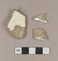 Undecorated creamware body sherd; undecorated creamware rim sherd; undecorated pearlware body sherd