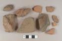 Brick fragments; redware roof tile fragment; stone fragment