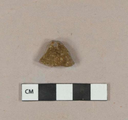 Partially burned undecorated lead glazed redware body sherd