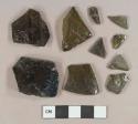Dark olive green vessel glass fragments, likely bottle glass