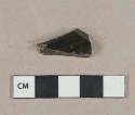 Dark olive green vessel body fragment, likely bottle