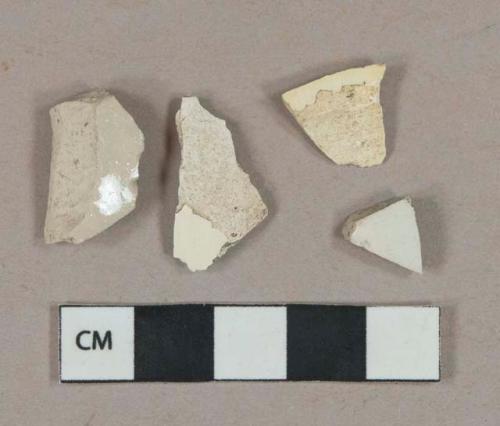 Undecorated creamware vessel body fragments, light buff paste; undecorated buff salt-glazed stoneware vessel body fragments, gray-buff paste; white undecorated salt-glazed stoneware vessel body fragment, gray paste