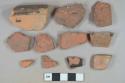 Brown lead glazed redware vessel rim and body fragments; 7 red brick fragments, possible roof tile fragments; 1 stone fragment