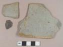Gray mudstone fragments, possibly architectural; 1 dark gray slate fragment