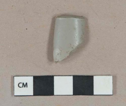 Gray plastic fragment, possible pipe fragment