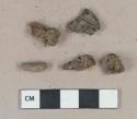 3 ferrous metal nail fragments, heavily corroded; 2 wood charcoal fragments