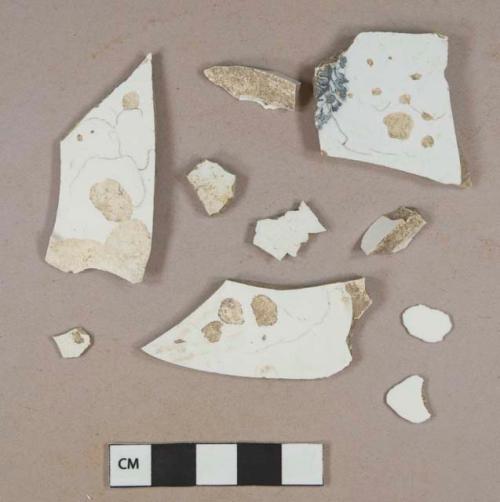 Undecorated whiteware body sherds; one black transfer printed whiteware body sherd