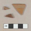 Nottingham type stoneware body sherds, one with incised decoration; Nottingham type stoneware rim sherd with incised decoration