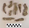 Unidentified iron nail fragments, one with olive green bottle glass fragment adhered to it; unidentified iron fragments