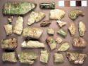 18 fragments of carved jade rectangular beads with "mat" or "plaid" motifs - var