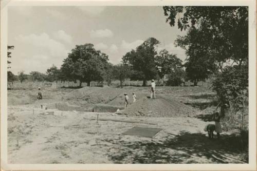 Trenches and dirt piles from removal