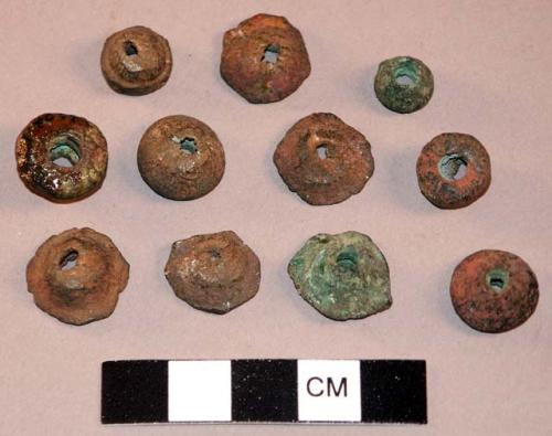Copper beads or spindle whorls