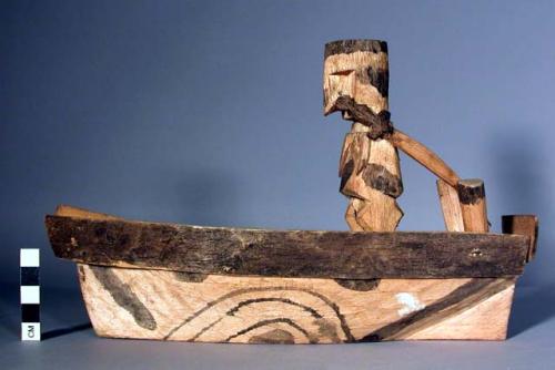 Boat of balsa wood with figures of balsa