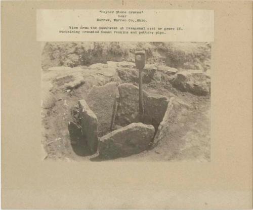 View from the southwest at hexagonal cyst or Grave IV containing cremated human remains and pottery pipe