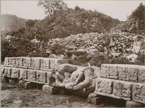 Plate V, Figure 2, Blocks from two steps of the Hieroglyphic Stairway, showing a broken sculpture representing a reclining human figure in central part of stairway