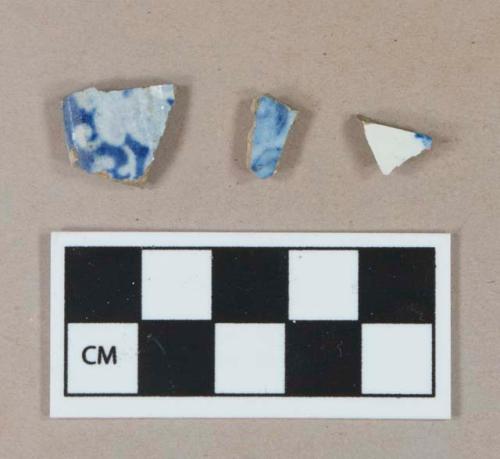 Molded blue transfer printed refined earthenware rim sherd; blue transfer printed pearlware body sherd; blue decorated pearlware body sherd