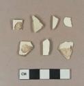 Undecorated creamware body sherds; undecorated creamware rim sherd