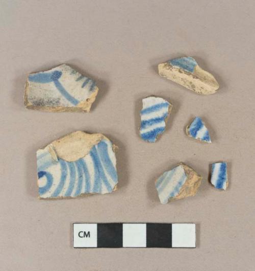 Blue hand painted tin glaze earthenware body sherds; blue hand painted tin glaze earthenware base sherd; blue hand painted tin glaze earthenware rim sherds