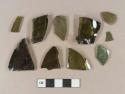Olive green bottle glass fragments; olive green bottle glass base fragment; teal bottle glass fragment