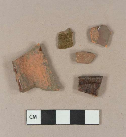 Undecorated lead glazed redware body sherds; undecorated lead glazed redware rim sherd