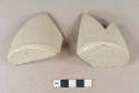 Buff bodied, buff glazed stoneware bottle base sherds; two sherds crossmend