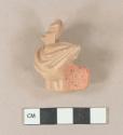 Unglazed, molded redware figurine fragment