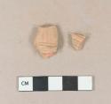 Molded, unglazed redware body sherds, possibly part of a figurine; two sherds crossmend, broken during inventory