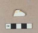 Porcelain body sherd, with possible yellow overglaze paint or gilding