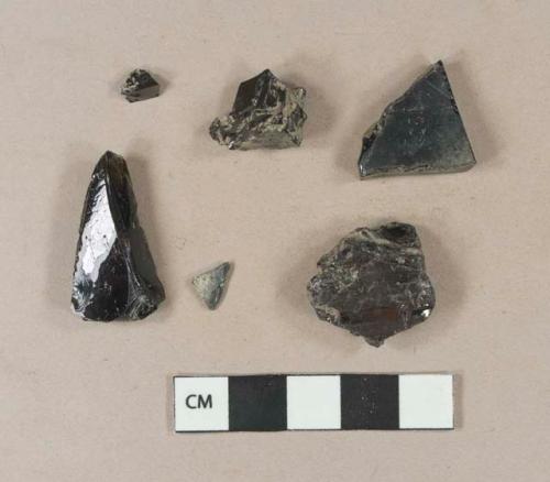 Coal fragments; olive green bottle glass fragments