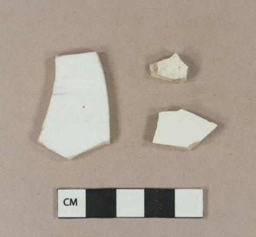 Undecorated porcelain body sherds; undecorated ironstone body sherd