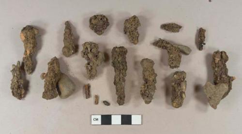 Unidentified iron nail fragments; unidentified iron fragments; stone