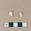 Calcined animal bone fragments; two fragments crossmend