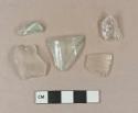 Colorless glass vessel body fragments, 1 possible paneled tumbler fragment; 2 light aqua vessle glass fragments