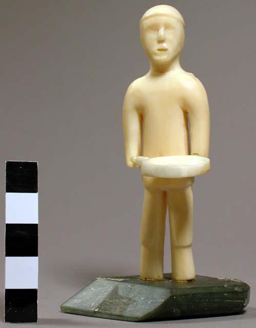 Ivory carving of a man playing a drum