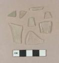 Colorless flat glass fragments; 1 aqua flat glass fragments; 3 colorless vessel glass body fragments
