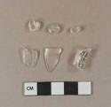 Colorless glass vessel rim fragment, 4 colorless glass handle fragments