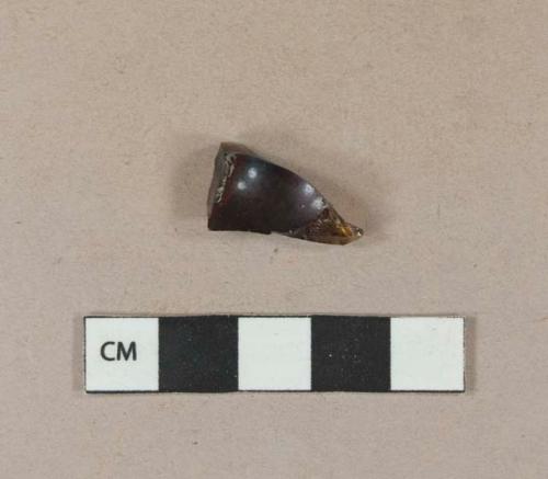 Dark amber vessel glass fragment