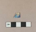 Blue on white transferprinted earthenware vessel rim fragment, white or light buff paste