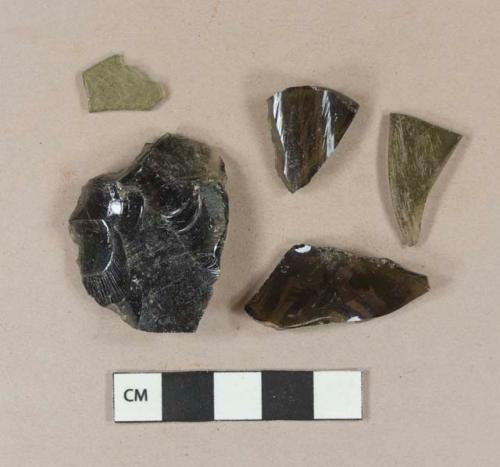 Olive green vessel glass body fragments, likely bottle glass