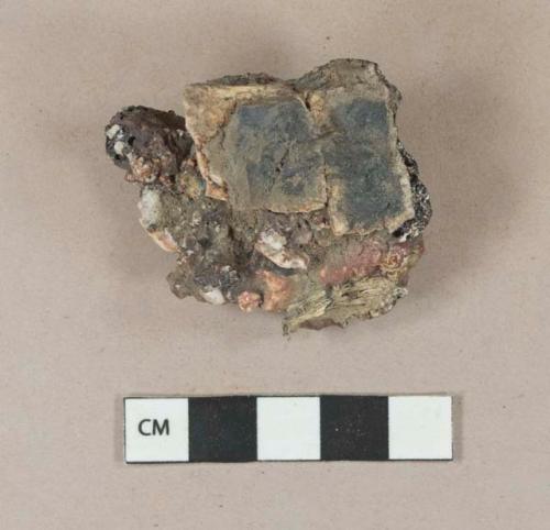 Slag fragment with adhered burned coal and clinker