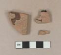 Brown lead glazed redware vessel body fragments, 1 fragment with black or very dark brown lead glaze