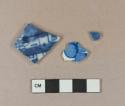 Blue on white hand painted porcelain vessel body fragments, white paste; Blue on white transferprinted whiteware vessel body fragment, white paste
